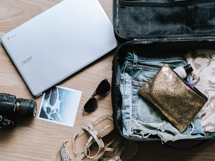 Open suitcase prepared for a luxury tropical journey