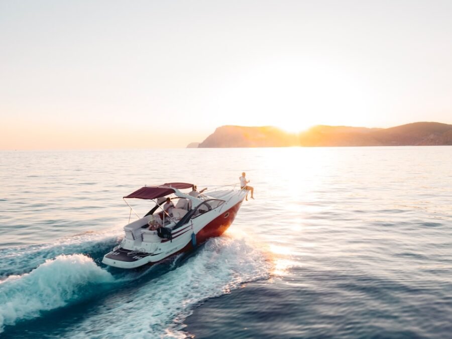 Private yacht sailing along a tropical Pacific coast